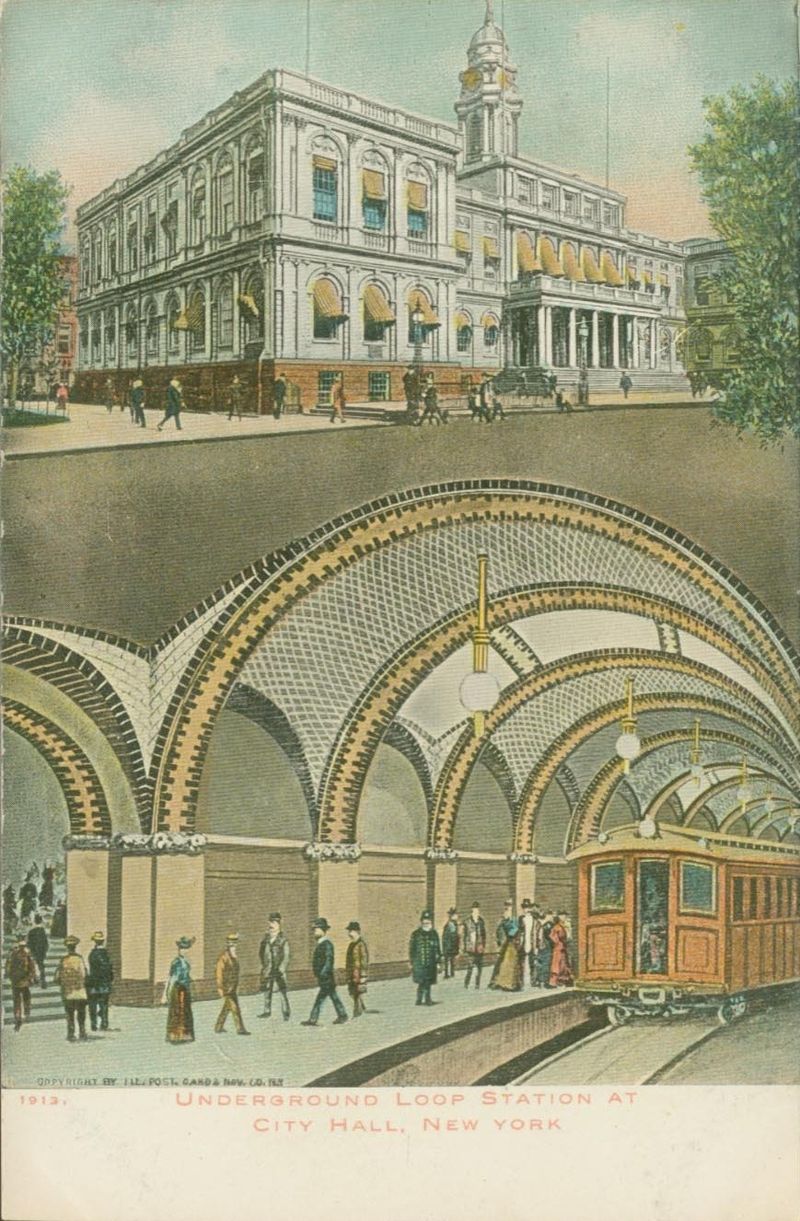 Postcard showing City Hall and the station, c. 1913 image credit: By Illustrated Post Card and Novelty Company - eBay store Web pages: (description): http://cgi.ebay.com/Underground-Loop-Station-at-City-Hall-New-York-City_W0QQitemZ400017702801QQcmdZViewItemQQptZLH_DefaultDomain_0?hash=item400017702801&_trksid=p3911.c0.m14&_trkparms=72%3A1205%7C66%3A4%7C65%3A12%7C39%3A1%7C240%3A1318 (image): http://al-g.smugmug.com/photos/436274547_uSkN2-O.jpg, Public Domain, https://commons.wikimedia.org/w/index.php?curid=5518681