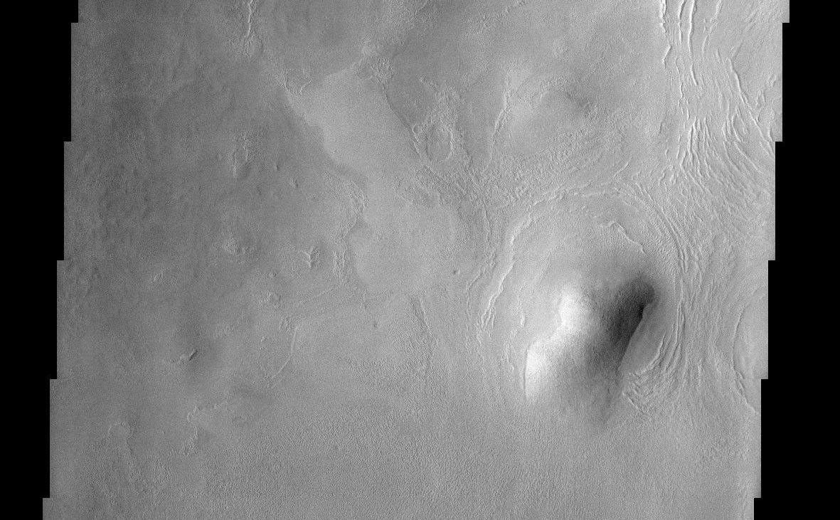 This THEMIS image of rounded hills and ridges in Arcadia Planitia shows a very intriguing geomorphic feature that may be attributed to the presence of an icy-rock mixture of material. image credit: NASA/JPL-Caltech